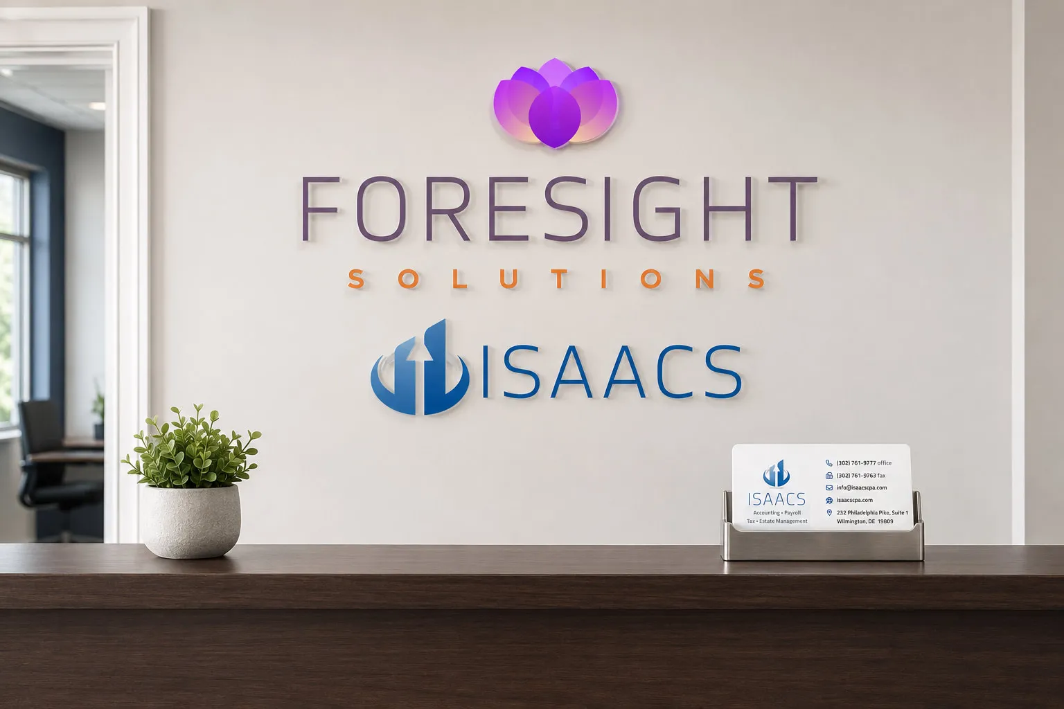 Isaacs and Foresight Solutions logos shown together as office wall signage